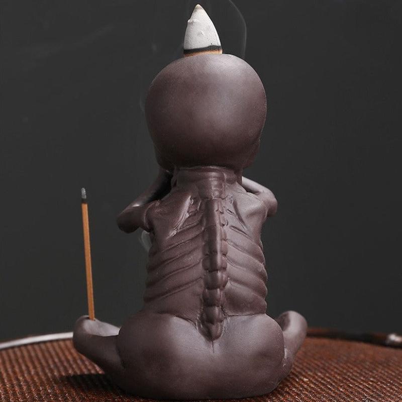 skull incense stick holder